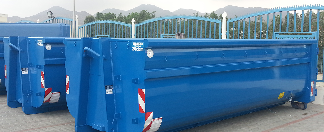 Blue Ro-Ro bulk waste containers placed outdoors